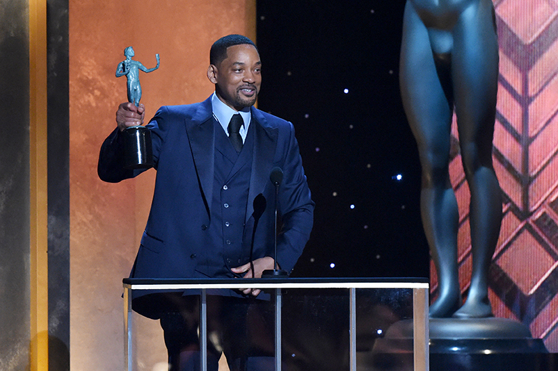 Will Smith accepts the Outstanding Performance by a Male Actor in a Leading Role award for ‘King Richard’ onstage at the 28th Screen Actors Guild Awards.