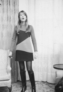 Francoise Hardy wearing an Yves St. Laurent thigh-length dress in her hotel during an interview with Women's Wear Daily to promote her new movie "Grand Prix,” at Basin St. East, on November 22, 1966 in New York.