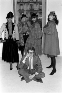 Yves Saint Laurent poses with models in his RTW Fall 1980 collection in his atelier in Paris.