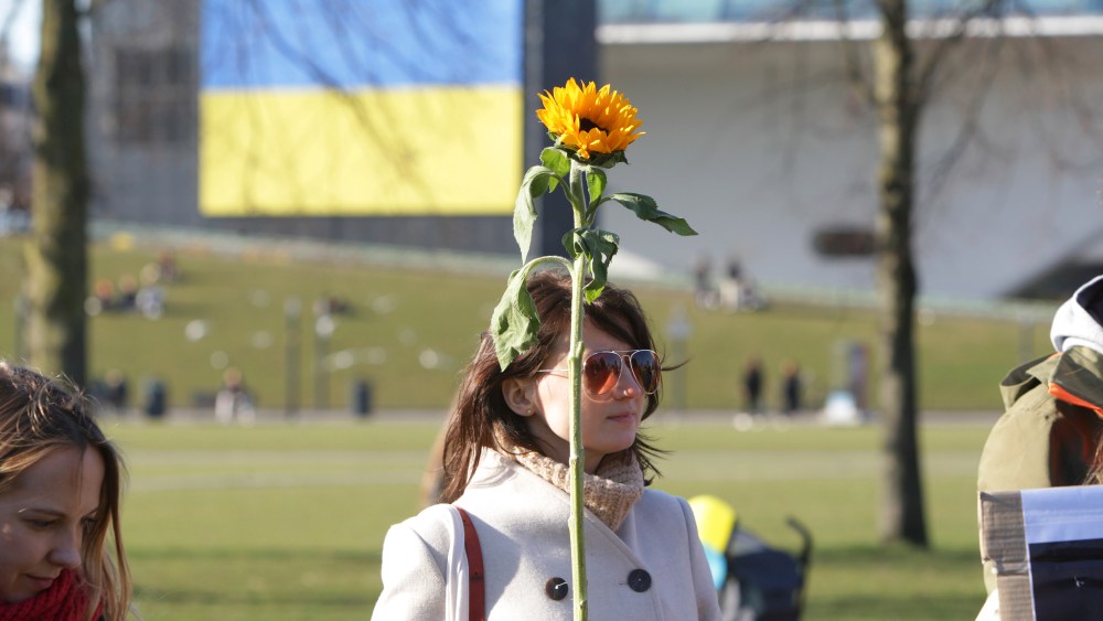 Women protest in support of International Women's Day gather in front of the consulate general of United States at the Museumplein on March 8, 2022 in Amsterdam,Netherlands. Ukraine's number of refugees fleeing the Russian invasion over two million, a million women and children have fled Ukraine in order to escape the War, reported byÊUNHCR-UN Refugee Agency. (Photo by Paulo Amorim/Sipa USA)(Sipa via AP Images)