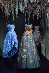 Floral-themed dresses on display at La Galerie Dior in Paris.
