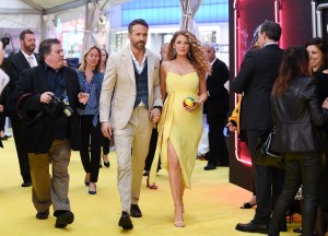 Actor Ryan Reynolds, left, is joined by his pregnant wife, actress Blake Lively at the premiere of "Pokemon Detective Pikachu" at Military Island in Times Square on Thursday, May 2, 2019, in New York. (Photo by Evan Agostini/Invision/AP)