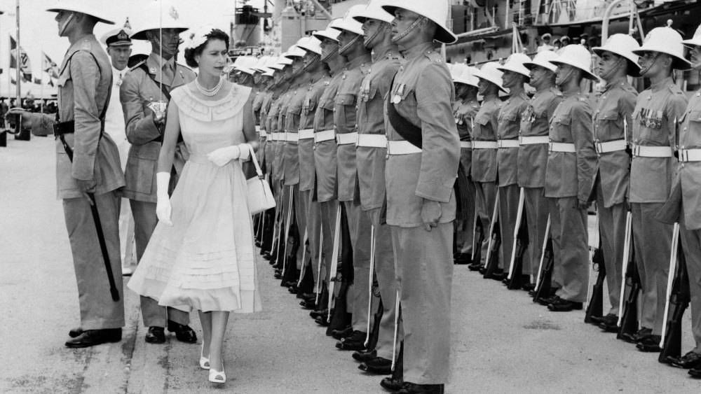 The Queen inspects the Royal Guard of Royal Marines from HMS Newfoundland during her visit to Colombo, Ceylon (now Sri Lanka), 11 April 1954.