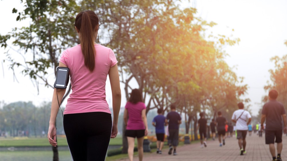 people exercise walking in the park