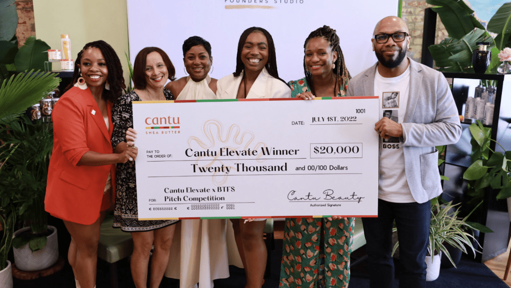 Skmuse founder Ezinne Iroanya, winner of the 2022 Cantu Elevate Entrepreneur Pitch Program receiving her $20,000 grant