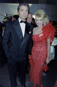 Bill Blass (C, partially obscured) and Ivana Trump (R) attend a Council of Fashion Designers of America event at JP Morgan Atrium in New York City on February 9, 1998.
