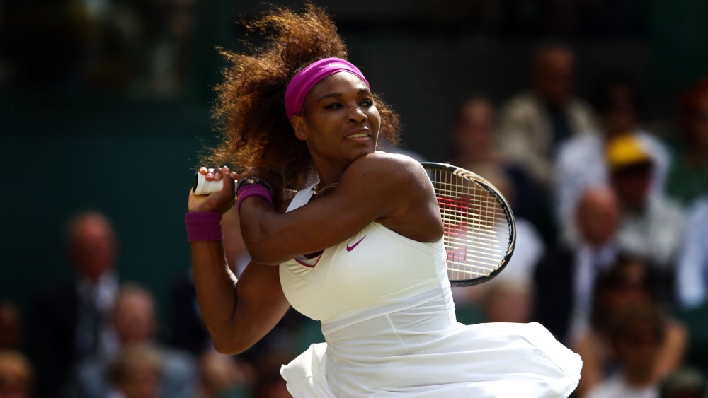 LONDON, ENGLAND - JULY 05:  Serena Williams of the USA returns a shot during her Ladies' Singles semi final match against  Victoria Azarenka of Belarus on day ten of the Wimbledon Lawn Tennis Championships at the All England Lawn Tennis and Croquet Club on July 5, 2012 in London, England.  (Photo by Clive Brunskill/Getty Images)