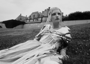Alexander McQueen's polyester gown. East Village Hats flapper band with silver beaded fringe; Roberto Coin gold chain bracelet; R.J. Graziano cocktail ring; Anna Beck ring; IVI ring; Eriness rings; Yi Collection ring.