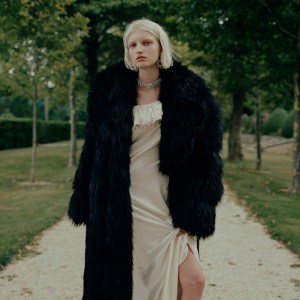 Saint Laurent's faux fur coat and silk dress. Jennifer Behr crystal necklace; Joomi Lim crystal earring