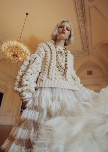 Giambattista Valli's lace dress under Ulla Johnson's cotton hand cable-knit sweater. Joomi Lim earring; Chanel necklaces and ring; R.J. Graziano crystal ring; Eriness ring.