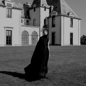 Balenciaga's polyester dress and boots and Simone Rocha's balaclava. R.J. Graziano cocktail ring; Anna Beck ring; IVI ring; Eriness rings; Yi Collection ring