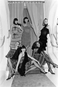 Model Alva Chinn and other models pose for Marc Bohan for Christian Dior Fall 1977 Ready to Wear Presentation in Paris.