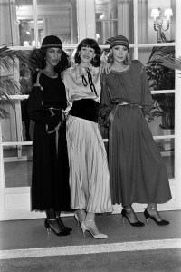 Alva Chinn poses with models in party dresses from the Marc Bohan for Christian Dior fall 1977 ready to wear advance.