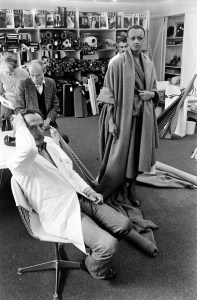 Marc Bohan poses with a model during a fit session for the Christian Dior fall 1978 Haute Couture collection at the Dior atelier design studios in Paris on July 7, 1978.