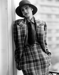 A model poses in Dior's high waisted skirt suit for fall 1985 designed by Marc Bohan.