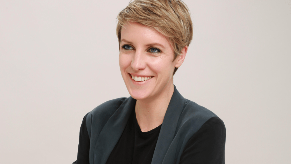 A headshot of Noelle Sadler in greyscale