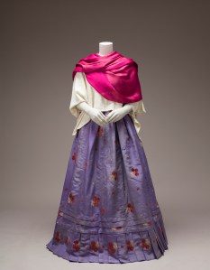 Rebozo and cotton huipil, silk skirt with woven velvet floral motifs.