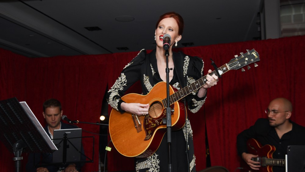 Karen Elson with a guitar