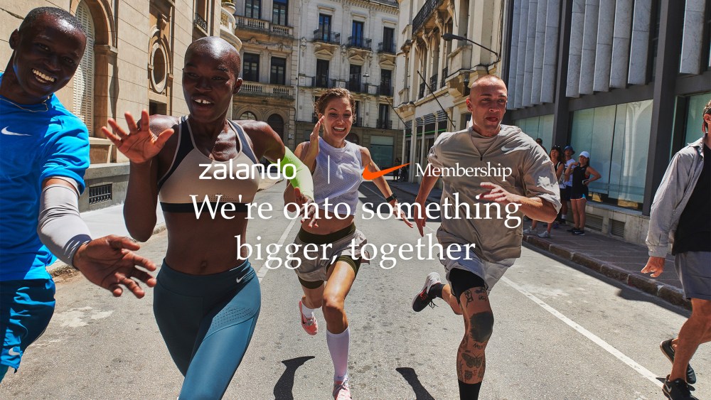 An image promoting the new partnership between Zalando and Nike features five people wearing Nike exercise clothes running down a street.