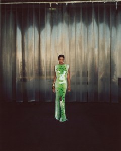 Bottega Veneta’s printed sequined dress and leather boots. Alexis Bittar gold bangles.
