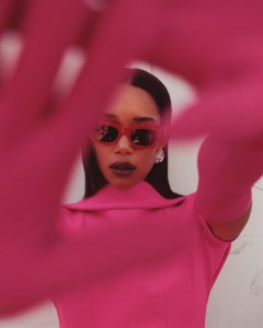 Valentino’s crepe couture dress and gloves. Bec + Bridge x Pared sunglasses. Miu Miu earring.