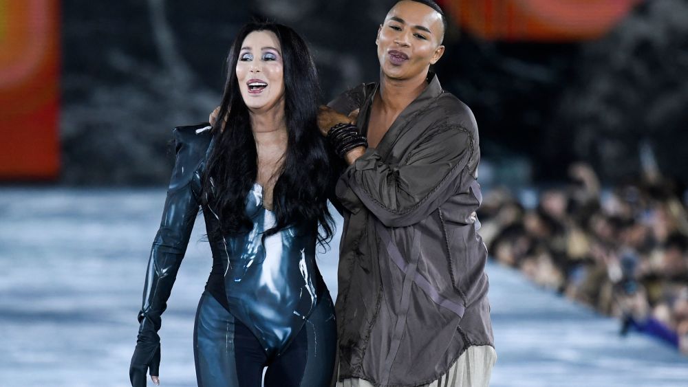 Cher and Olivier Rousteing on the runway at the Balmain spring 2023 fashion show, top 10 most searched celebrities at paris fashion week
