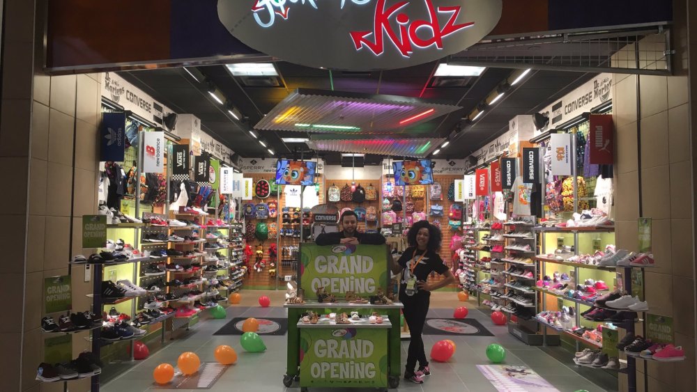 Genesco trimmed its full-year guidance after a disappointing second quarter, and now expects sales to dip as much as 3 percent this year.
