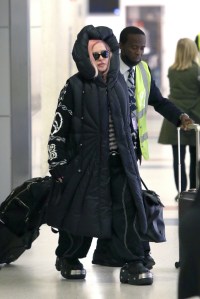 madonna, jfk airport, black coat, balenciaga crocs, platform, hood, sunglasses