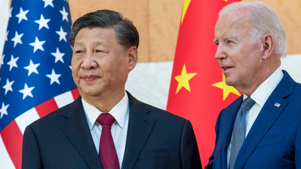 U.S. President Joe Biden, right, stands with Chinese President Xi Jinping before a meeting on the sidelines of the G20 summit meeting, Monday, Nov. 14, 2022, in Bali, Indonesia. Biden says Chinese counterpart Xi has agreed to resume crucial talks on climate between the two countries. The Chinese and U.S. leaders met Monday on the sidelines of the Group of 20 summit in Bali. (AP Photo/Alex Brandon)
