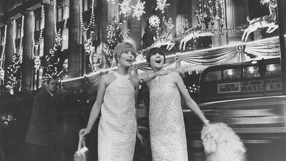 Outside the Selfridges department store, wearing dresses by French designer Piere Cardin.