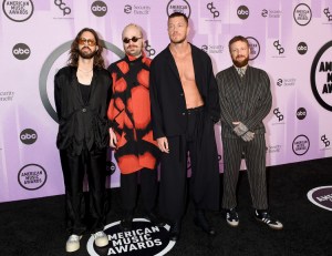 Daniel Wayne Sermón, Daniel Platzman, Dan Reynolds and Ben McKee of Imagine Dragons at the 2022 American Music Awards held at the Microsoft Theater at L.A. Live on November 20, 2022 in Los Angeles, California.