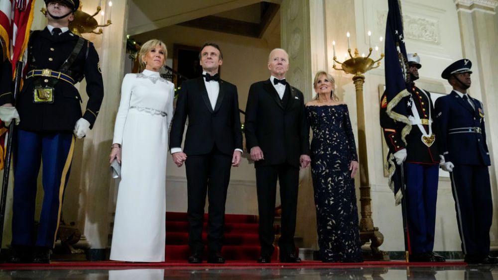 WASHINGTON, DC - DECEMBER 1: U.S. President Joe Biden, first lady Jill Biden, French President Emmanuel Macron and his wife Brigitte Macron pose for photos at the Grand Staircase of the White House ahead of the state dinner on December 1, 2022 in Washington, DC. President Biden is hosting Macron for the first official state visit of the Biden administration. (Photo by Drew Angerer/Getty Images)