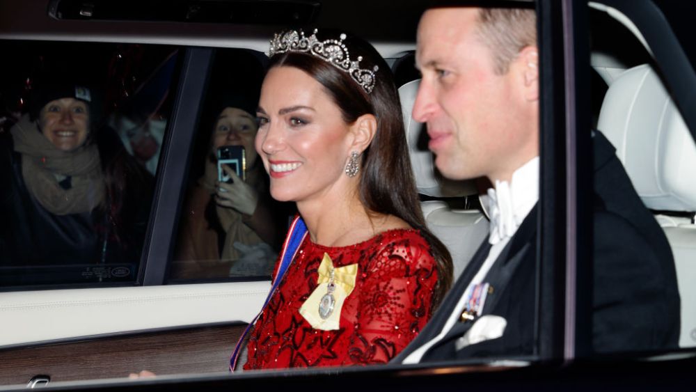 LONDON, UNITED KINGDOM - DECEMBER 06: (EMBARGOED FOR PUBLICATION IN UK NEWSPAPERS UNTIL 24 HOURS AFTER CREATE DATE AND TIME) Catherine, Princess of Wales (wearing the Lotus Flower Tiara) and red jenny peckham dress with Prince William, Prince of Wales depart after attending the annual Reception for Members of the Diplomatic Corps at Buckingham Palace on December 6, 2022 in London, England. This year's Reception for the Diplomatic Corp is the first hosted by King Charles III and the first since 2019 following a two year hiatus due to the COIVD-19 pandemic. (Photo by Max Mumby/Indigo/Getty Images)