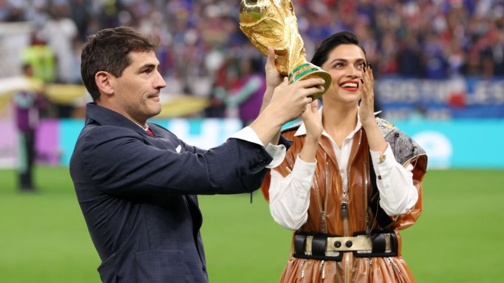 LUSAIL CITY, QATAR - DECEMBER 18: Iker Casillas and louis vuitton ambassador Deepika Padukone present the FIFA World Cup trophy prior to  the FIFA World Cup Qatar 2022 Final match between Argentina and France at Lusail Stadium on December 18, 2022 in Lusail City, Qatar. (Photo by Clive Brunskill/Getty Images)