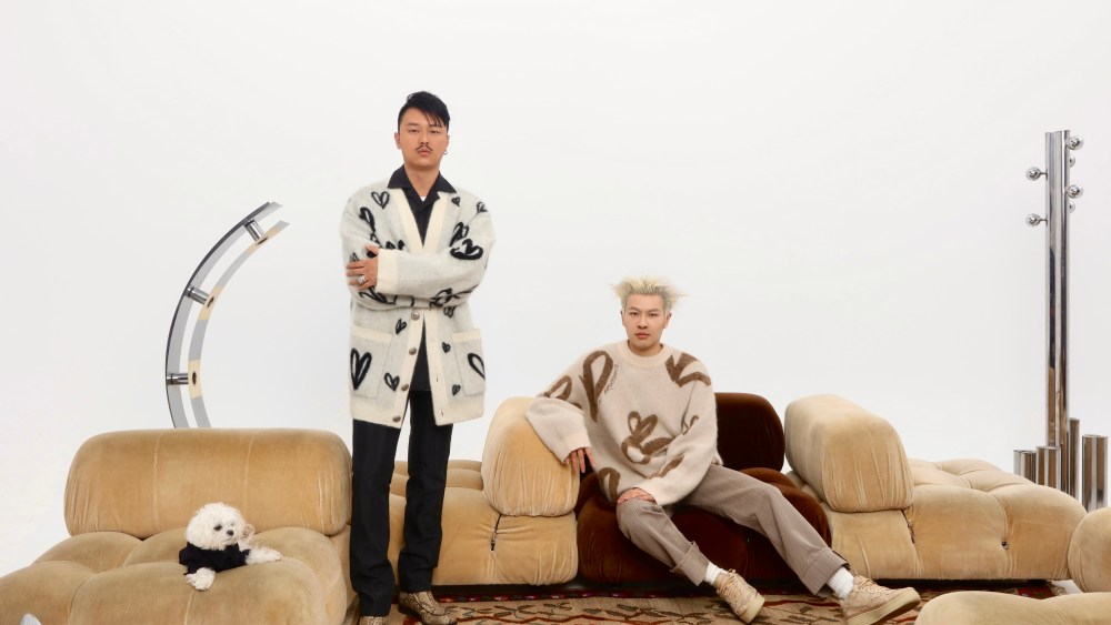 Pronounce designers Yushan Li and Jun Zhou wearing the Lanvin x Pronounce capsule collection.