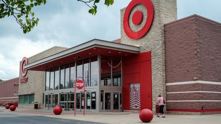 A woman walks in front of a Target store at Monroe Marketplace.