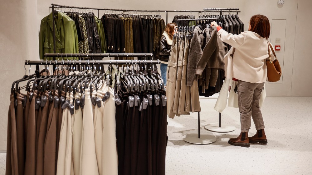 A woman looks at clothes in a Zara megastore at Boulevard Austria de València, on December 2, 2022, in Valencia, Valencia (Spain). The concept of this megastore replicates the model of other megastores recently opened by Zara in Battersea (London) and Plaza de España (Madrid), which offer an entire digital experience to customers with robots for the collection of online orders. They also combine all its traditional sections for men, women and children, along with new lines such as cosmetics. 02 DECEMBER 2022;FASHION;FAST FASHION;RETAIL;STORE;ESTABLISHMENT;CLOTHING;CLOTHING STORE;INDITEX;CONSUMPTION;CUSTOMERS;FACE-TO-FACE SALES;OPENING;SHOPPING;FLAGSHIP STORE;DONKEY;CLOTHES STAND;COAT RACK Rober Solsona / Europa Press 12/02/2022 (Europa Press via AP)