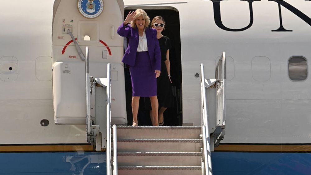 US First Lady Jill Biden (L) waves as she exits the plane upon her arrival at the Hosea Kutako International Airport in Windhoek on February 22, 2023. - US First Lady Jill Biden will visit Namibia and Kenya this week as the White House seeks an economic partnership with Africa contrasting Chinese investment and food shortages caused by Russia's invasion of Ukraine. (Photo by Tara Mette / AFP) (Photo by TARA METTE/AFP via Getty Images)