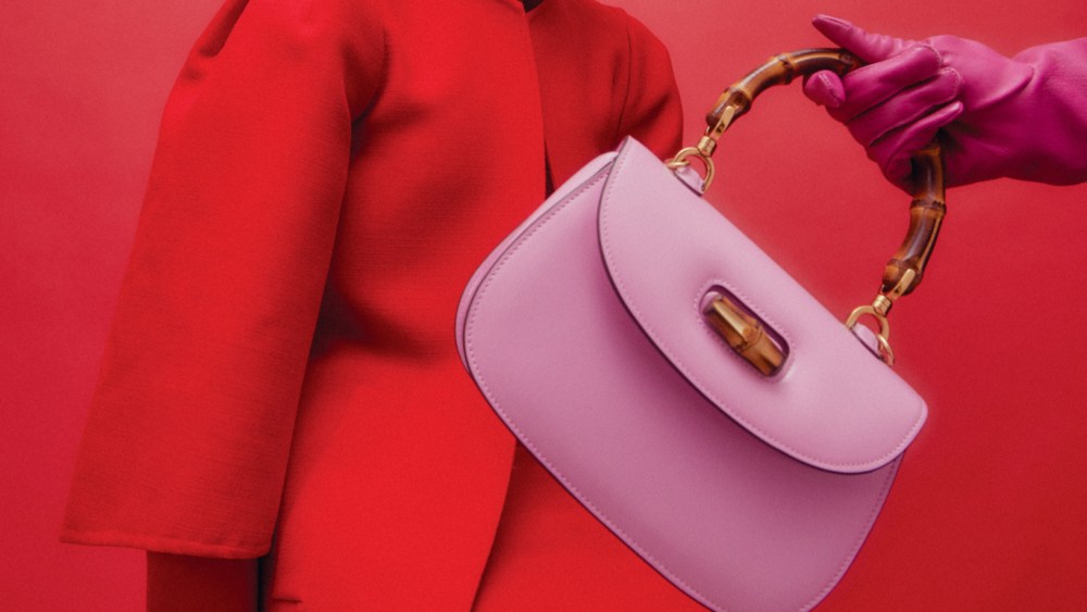 Gucci’s Bamboo 1947 mini top handle bag. Akris wool double-face coat and dress; Gucci sunglasses; Esenshel felt hat; Wing & Weft leather gloves.