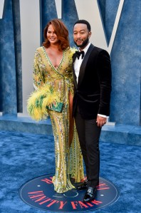 Chrissy Teigen and John Legend arrive at the 2023 Vanity Fair Oscar Party held at the Wallis Annenberg Center for the Performing Arts on March 12, 2023 in Beverly Hills, California.