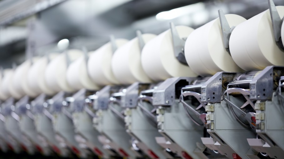 Yarn spinning machine in a modern textile factory.