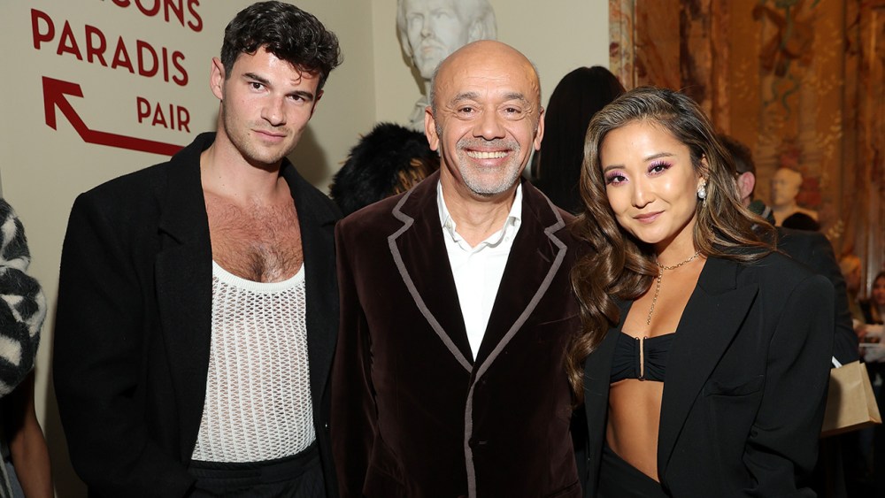 PARIS, FRANCE - MARCH 02: Paul Forman, Christian Louboutin and Ashley Park attend "The Loubi Show" as part of Paris Fashion Week  on March 02, 2023 in Paris, France. (Photo by Victor Boyko/Getty Images for Christian Louboutin)