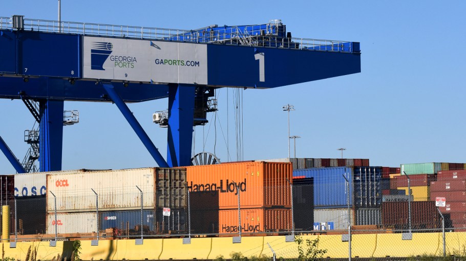 Shipping containers are seen under a crane at the Port of Savannah in Georgia.