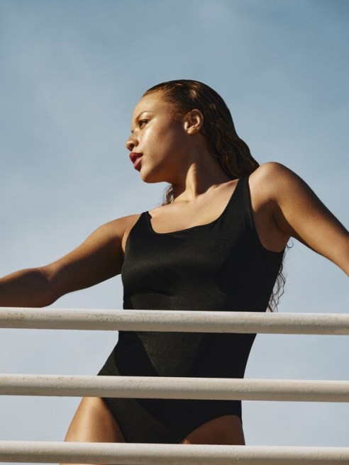 Watertex launches with a one-piece black swimsuit.