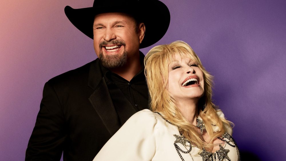 A promotional shot of 2023 ACM Awards hosts Garth Brooks and Dolly Parton.