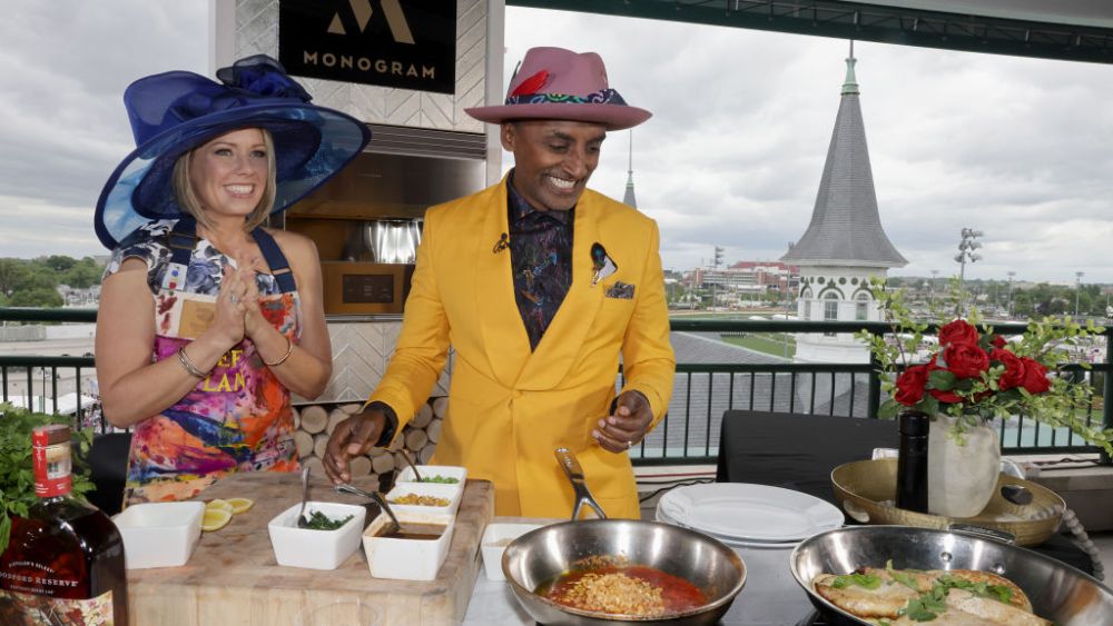 LOUISVILLE, KENTUCKY - MAY 07: Chef Marcus Samuelsson demos his fresh take on Derby recipes on Monogram Luxury Appliances with Dylan Dreyer (L), with the iconic Twin Spires™ behind them at Churchill Downs on May 07, 2022 in Louisville, Kentucky. (Photo by Tasos Katopodis/Getty Images for Monogram)