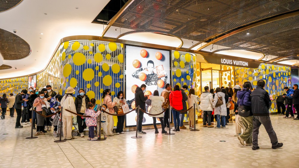 People line up at the Louis Vuitton store at the Taikoo Li Qiantan Mall in Shanghai, China.