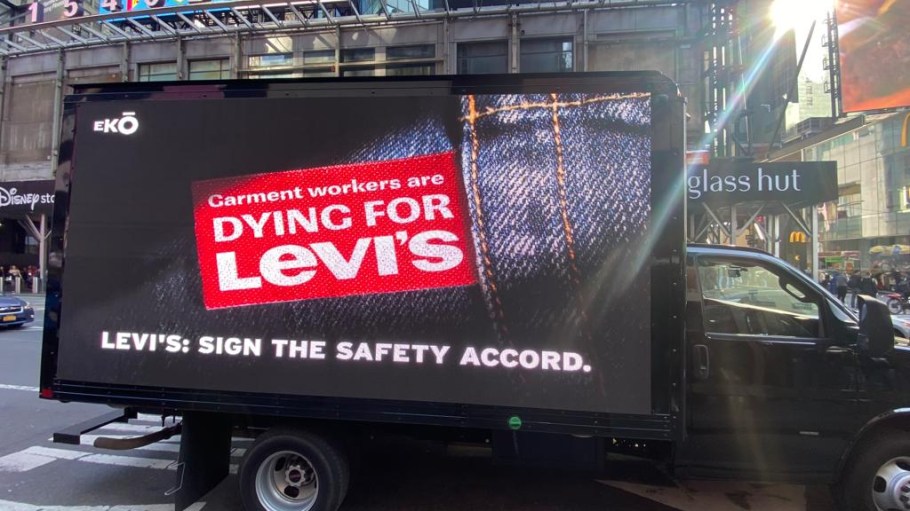 This truck branded with messaging urging Levi's to adopt a worker safety accord rolled into Times Square in front of the brand's flagship.
