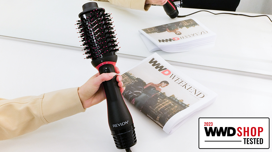 Editor holding Revlon's One Step Volumizer Plus Hair Dryer before testing