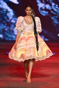 SYDNEY, AUSTRALIA - MAY 17: A model walks the runway in a design by Miimi & Jiinda during the David Jones Indigenous Fashion Projects - Presented by Afterpay show during Afterpay Australian Fashion Week 2023 at Carriageworks on May 17, 2023 in Sydney, Australia. (Photo by Stefan Gosatti/Getty Images for AAFW)